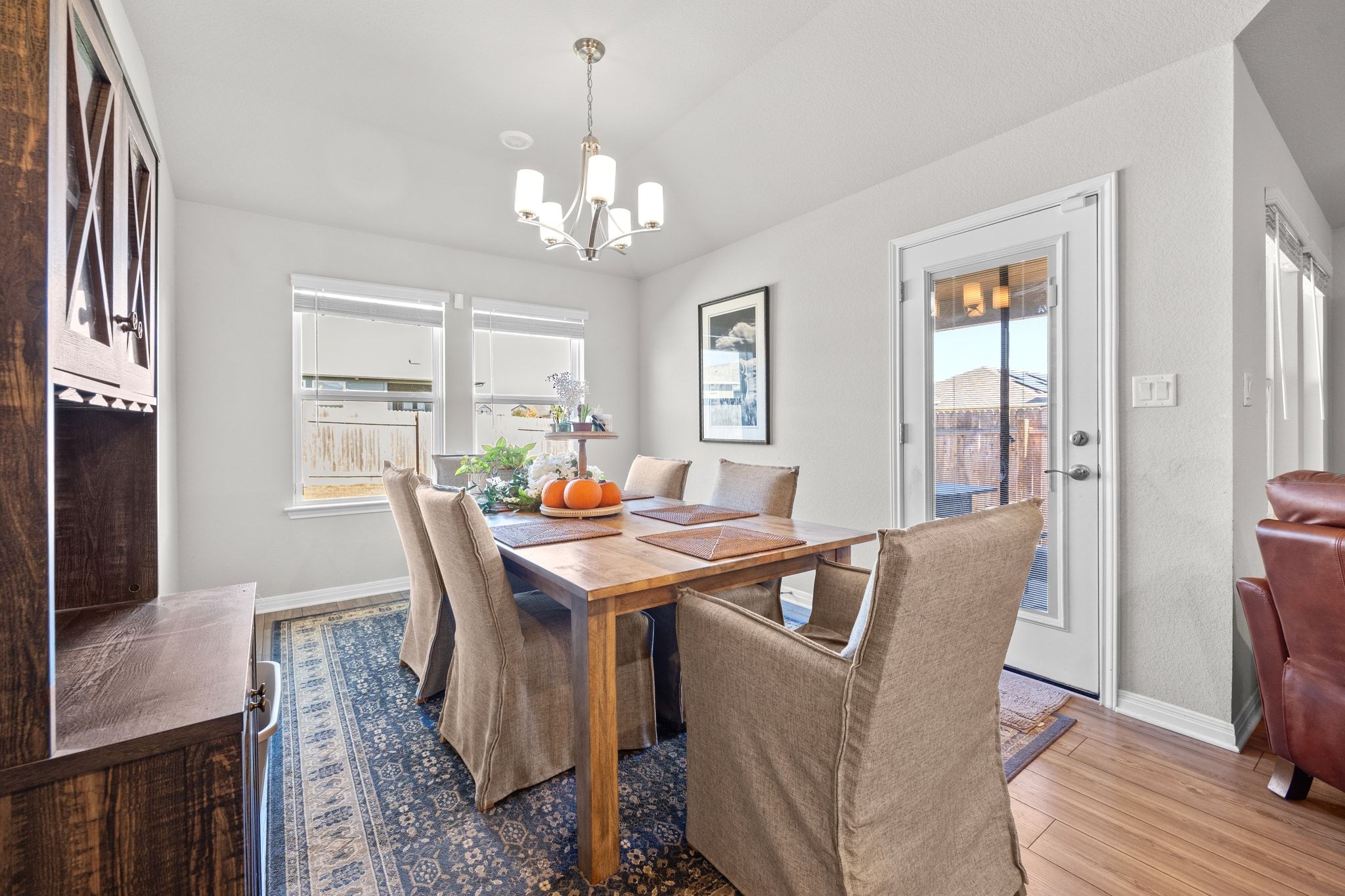 2856 Moyer Lane Round Rock, TX 78665 - Photo 9 of 27 Dining space featuring light wood finished floors and a chandelier