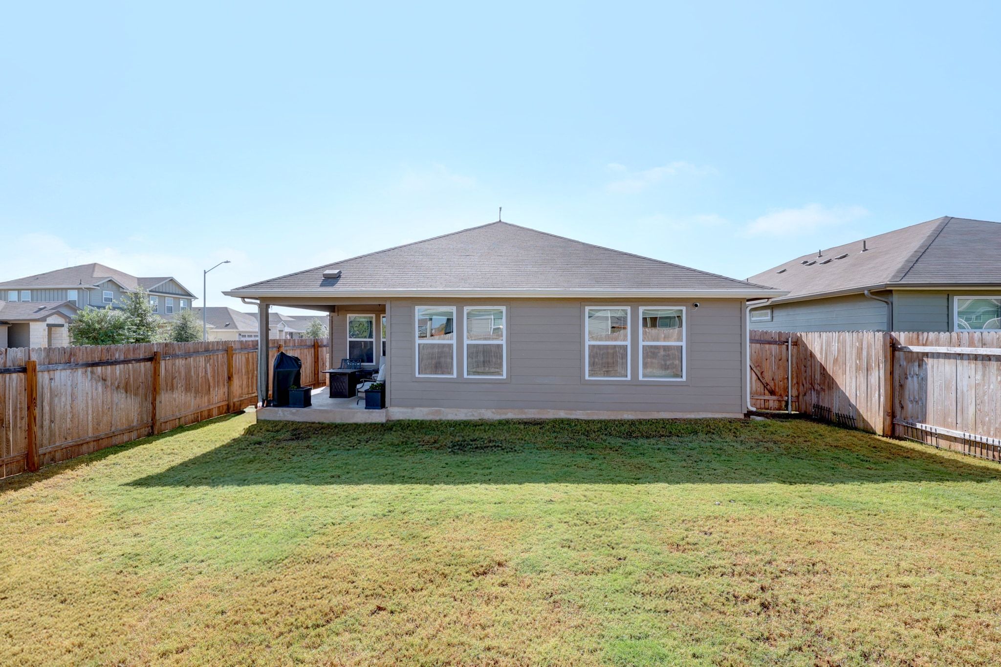 2856 Moyer Lane Round Rock, TX 78665 - Photo 19 of 27 Rear view of house with a patio and a fenced backyard