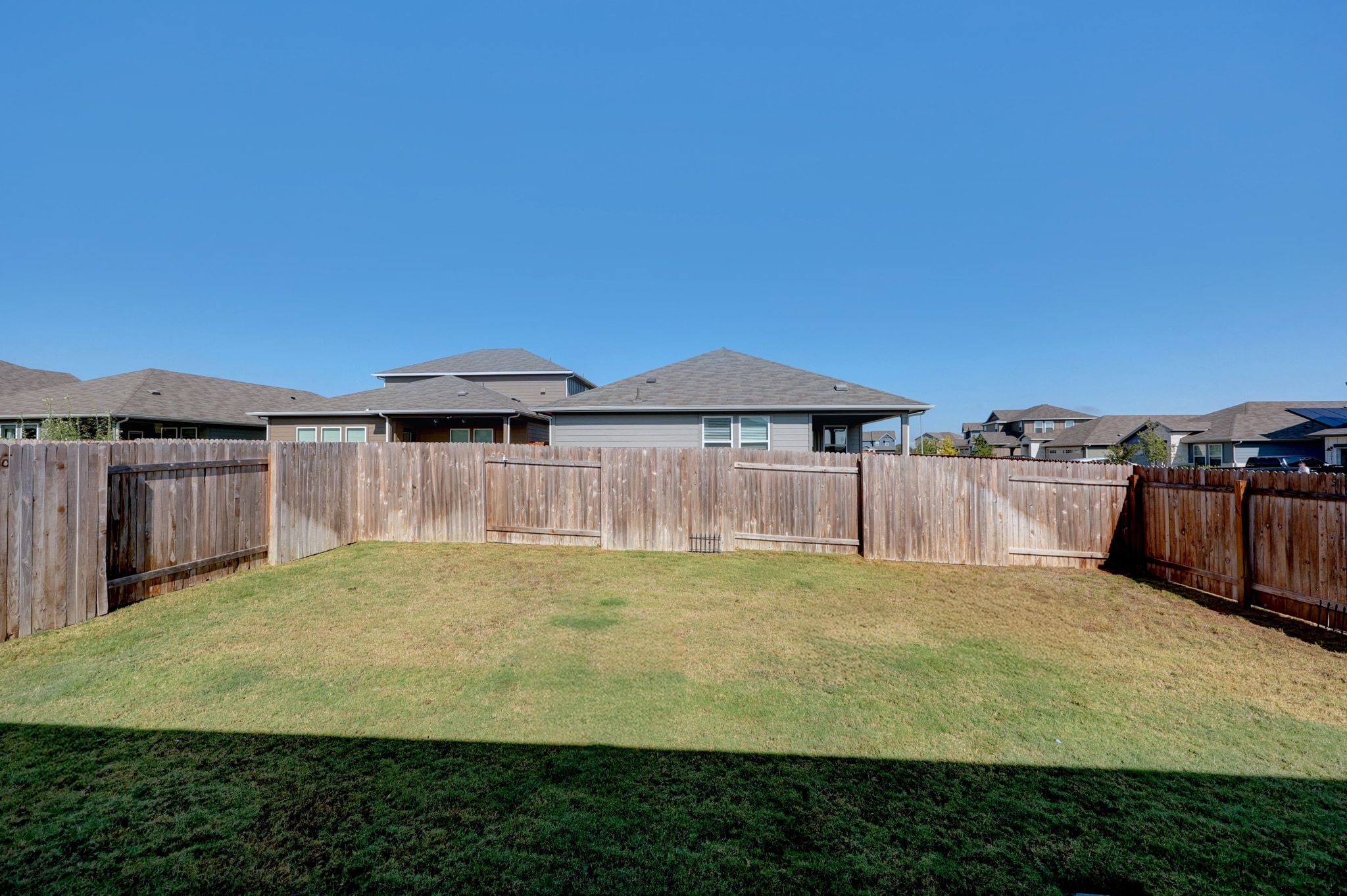 2856 Moyer Lane Round Rock, TX 78665 - Photo 20 of 27 Fenced backyard with a residential view