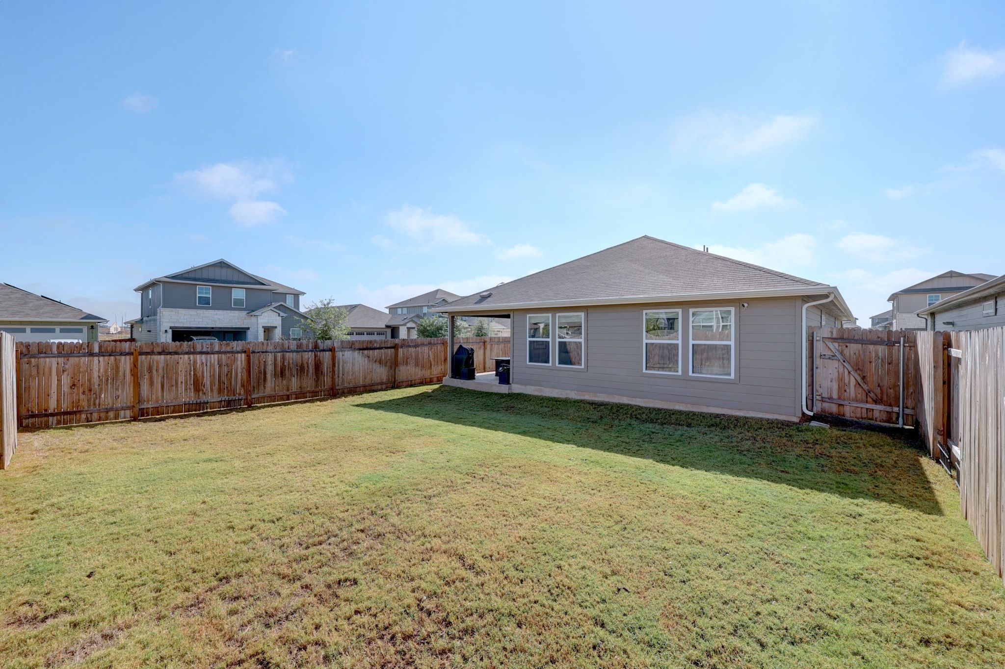 2856 Moyer Lane Round Rock, TX 78665 - Photo 24 of 27 Rear view of property with a fenced backyard and a patio area