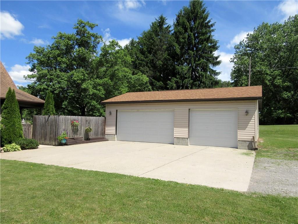 823 Sarver Road Sarver, PA 16055 - Photo 3 of 25 The 36x24' three-car detached garage and 36x30' cement parking pad have enough parking for all of your guests and are conveniently located only steps from the home!