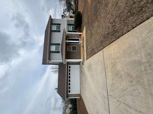 a house view with a garden space