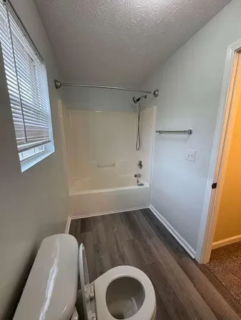 a bathroom with a toilet and a sink