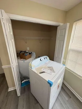 a utility room with dryer and washer
