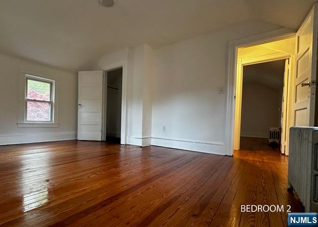 1156 High Mountain Road North Haledon, NJ 07508 - Photo 11 of 14 a view of an empty room with wooden floor and a window