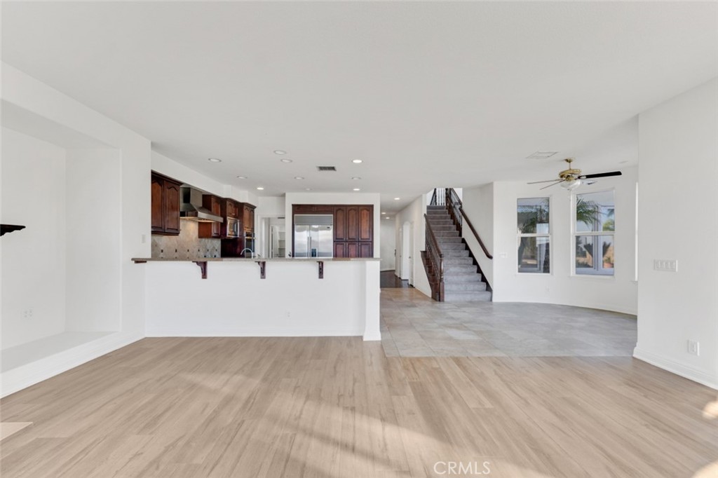 20212 Vía Medici Porter Ranch, CA 91326 - Photo 17 of 61 a view of a living room with furniture and wooden floor
