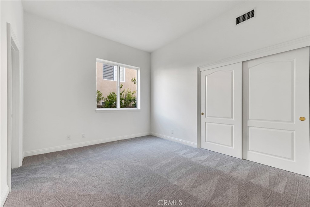 20212 Vía Medici Porter Ranch, CA 91326 - Photo 23 of 61 an empty room with windows and closet