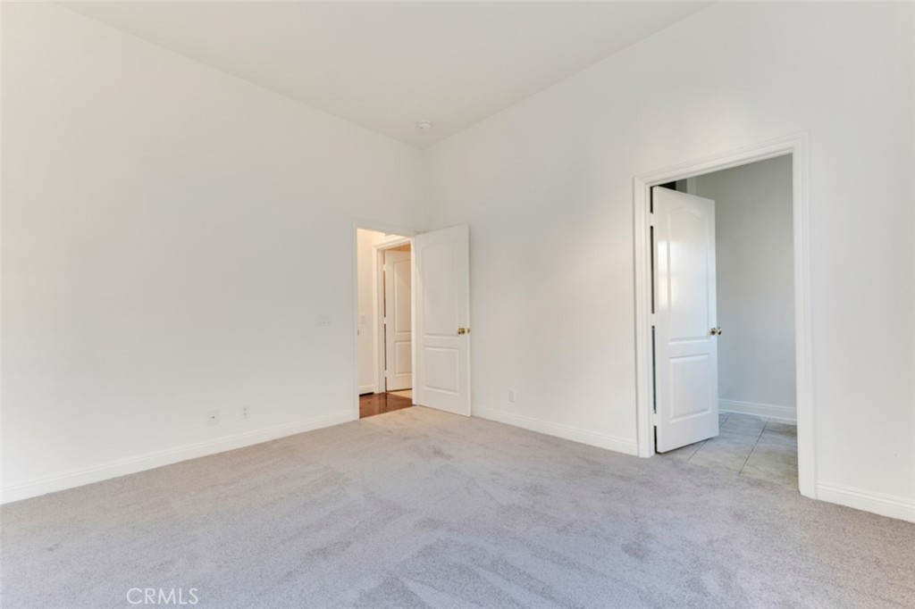 20212 Vía Medici Porter Ranch, CA 91326 - Photo 24 of 61 a view of an empty room and closet area