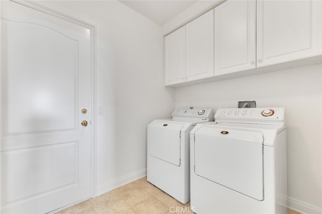 20212 Vía Medici Porter Ranch, CA 91326 - Photo 26 of 61 a utility room with dryer and washer