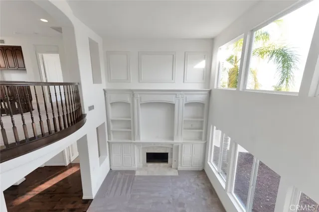 a view of a living room and balcony