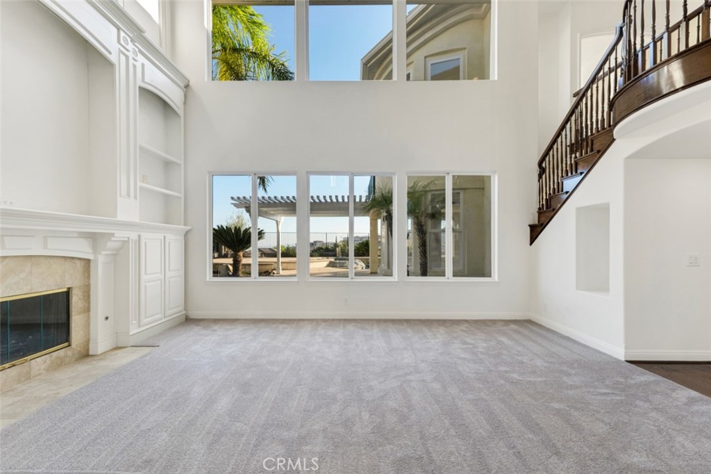 20212 Vía Medici Porter Ranch, CA 91326 - Photo 3 of 61 a view of an empty room with a fireplace