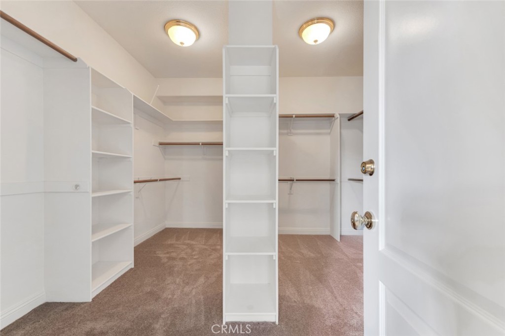 20212 Vía Medici Porter Ranch, CA 91326 - Photo 40 of 61 a view of walk in closet with empty racks