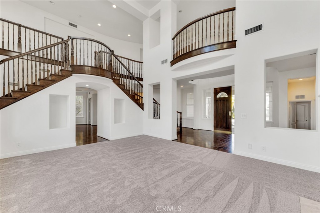 20212 Vía Medici Porter Ranch, CA 91326 - Photo 4 of 61 a view of staircase with white walls and a window