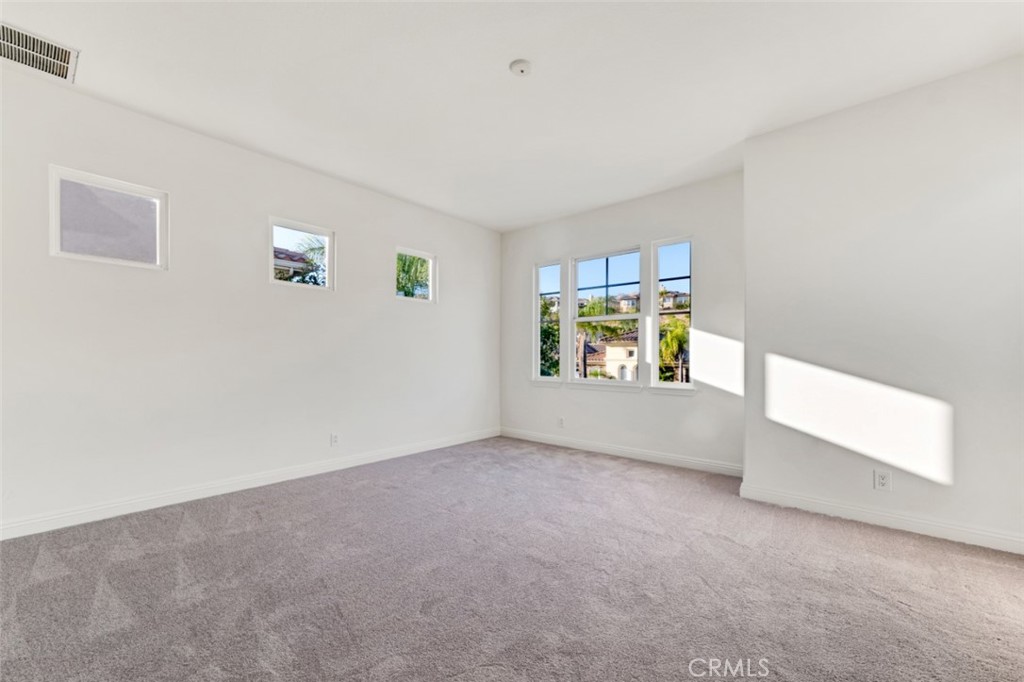 20212 Vía Medici Porter Ranch, CA 91326 - Photo 42 of 61 an empty room with windows