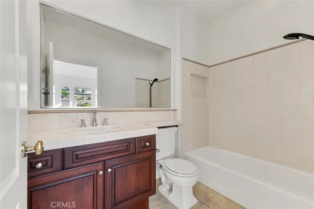 a view of a house with a swimming pool and sitting area