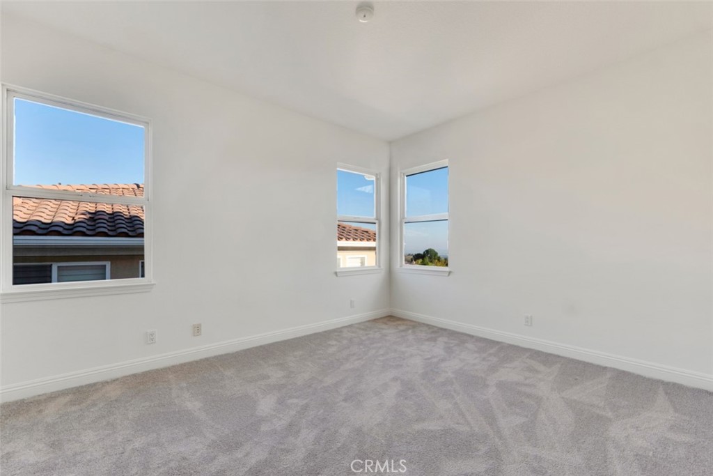 20212 Vía Medici Porter Ranch, CA 91326 - Photo 46 of 61 a view of an empty room with a window