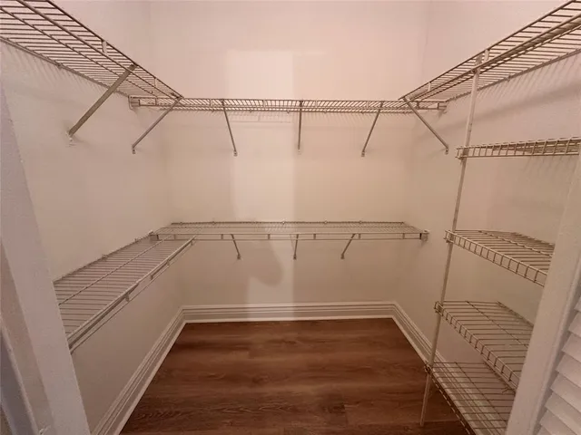 a view of a room with racks on the wall