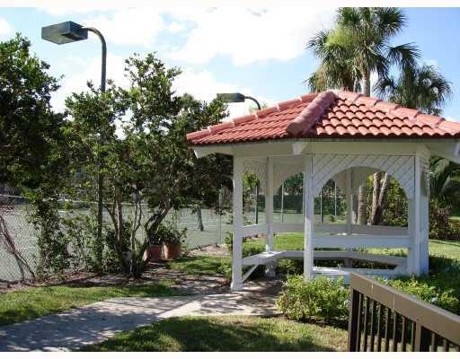 5661 Riverside Drive, Unit 202 Coral Springs, FL 33067 - Photo 19 of 25 a front view of a house with garden