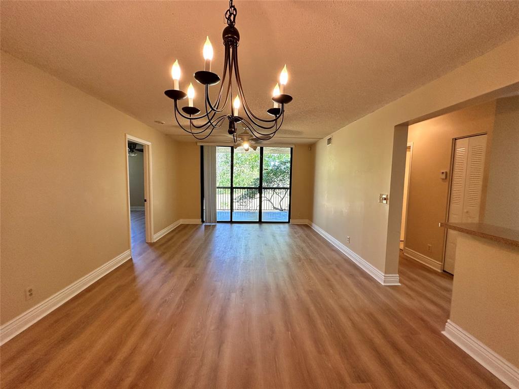 5661 Riverside Drive, Unit 202 Coral Springs, FL 33067 - Photo 6 of 25 a view of empty room with wooden floor