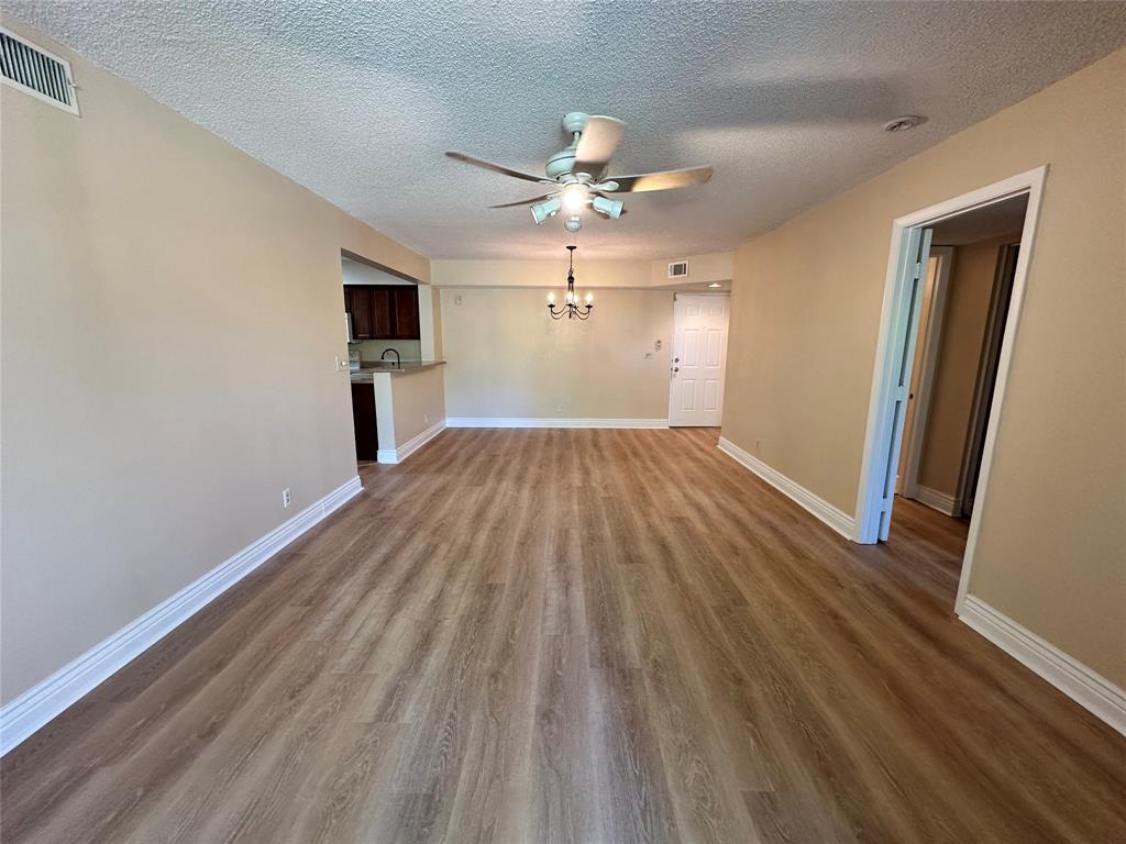 5661 Riverside Drive, Unit 202 Coral Springs, FL 33067 - Photo 7 of 25 wooden floor in an empty room with a window