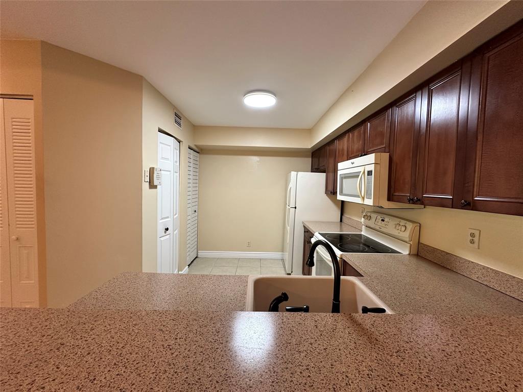 5661 Riverside Drive, Unit 202 Coral Springs, FL 33067 - Photo 8 of 25 a view of a room with gym equipment