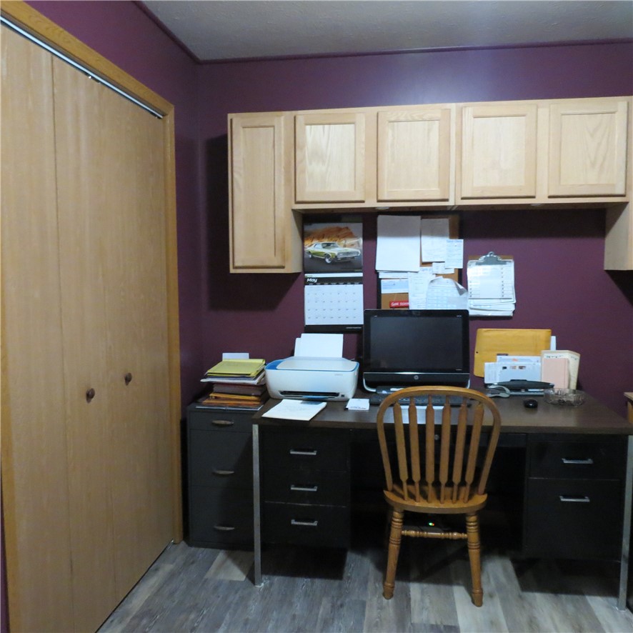 21242 Dingman-Slagle Road Pemberton, OH 45353 - Photo 15 of 33 This dedicated home office features practical storage and durable flooring.