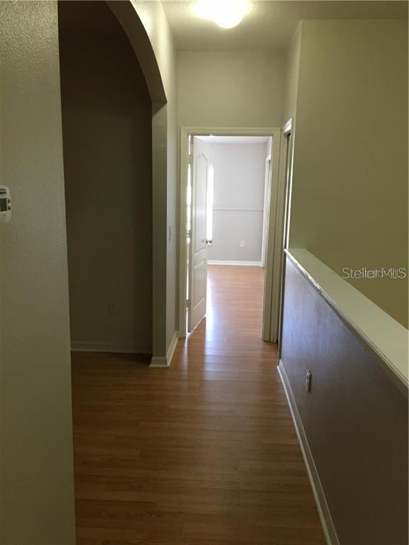 3426 High Hampton Circle Tampa, FL 33610 - Photo 12 of 27 a view of hallway with wooden floor