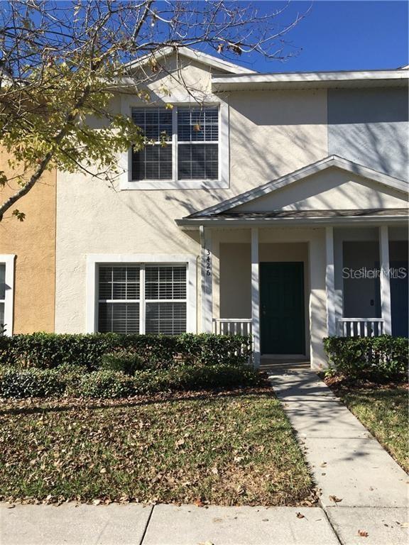 3426 High Hampton Circle Tampa, FL 33610 - Photo 2 of 27 a front view of a house with garden
