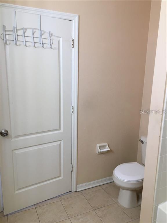 3426 High Hampton Circle Tampa, FL 33610 - Photo 22 of 27 a white toilet sitting next to a shower