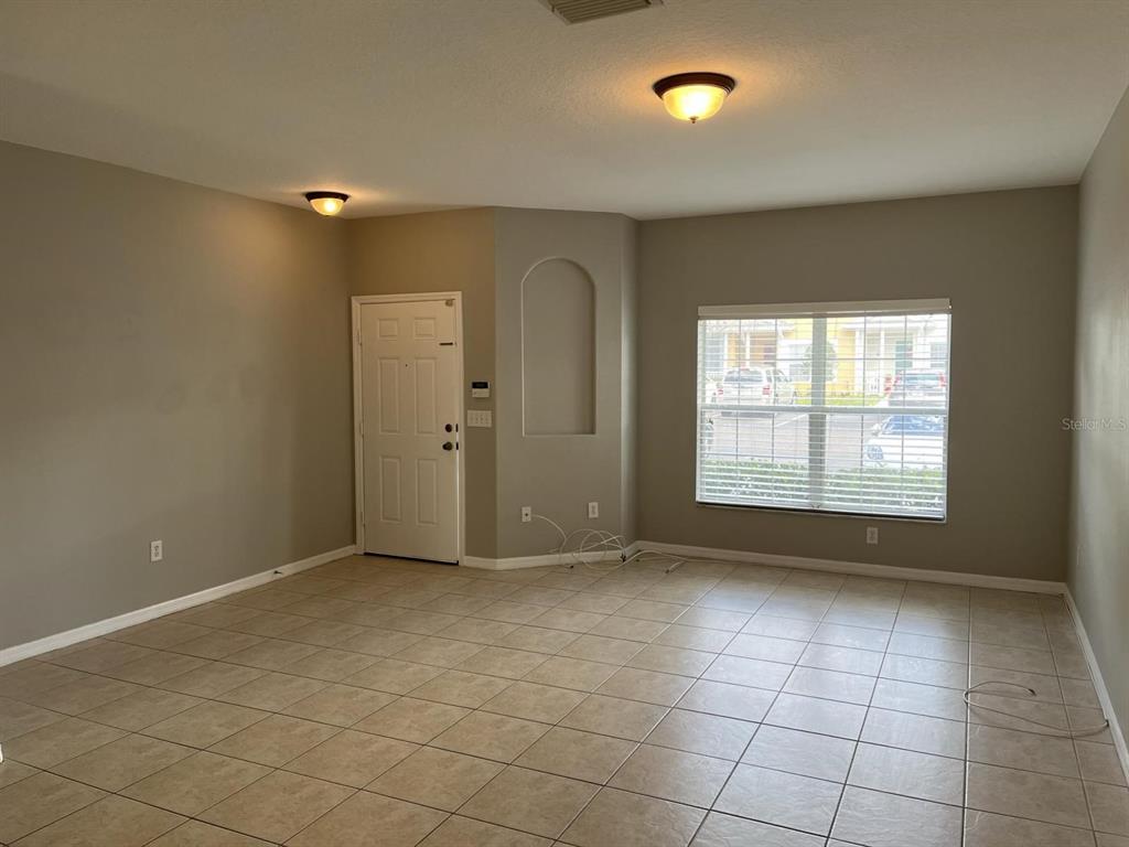 3426 High Hampton Circle Tampa, FL 33610 - Photo 3 of 27 a view of an empty room with a window