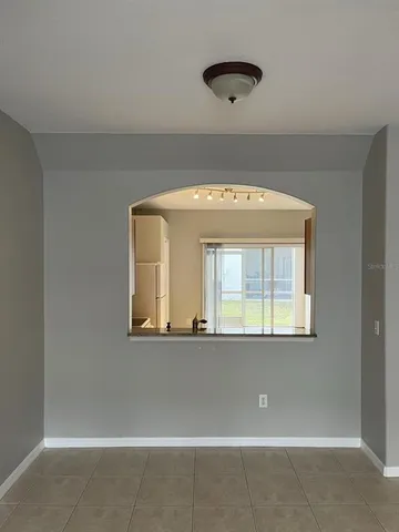 a view of a living room with a large window