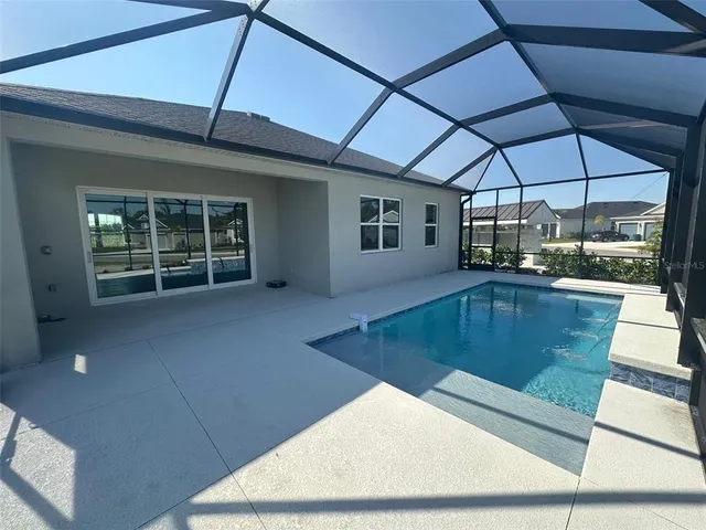 a view of a living room with a sink and dishwasher