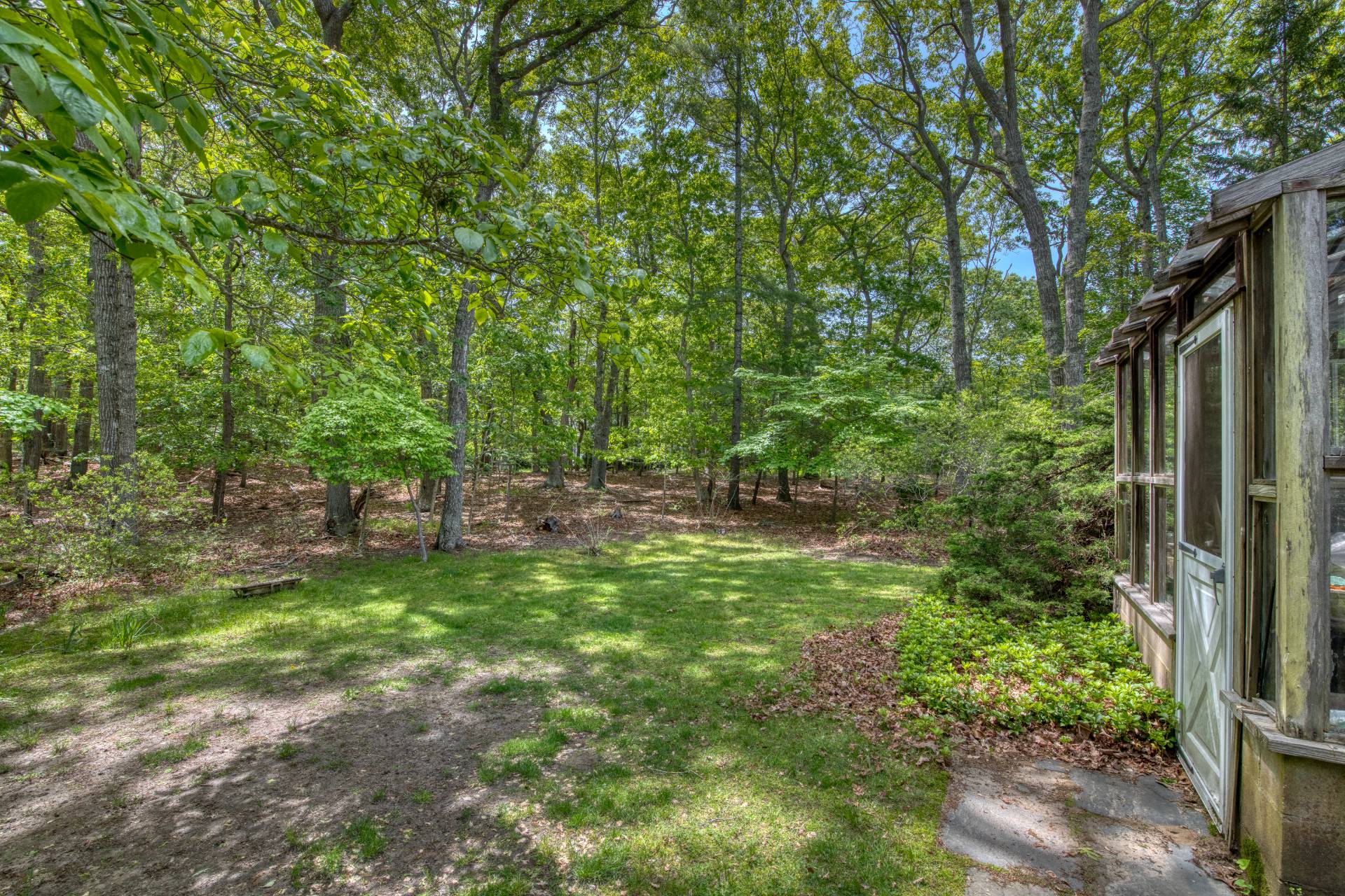 127 Copeces Lane East Hampton, NY 11937 - Photo 3 of 13 a view of backyard with green space