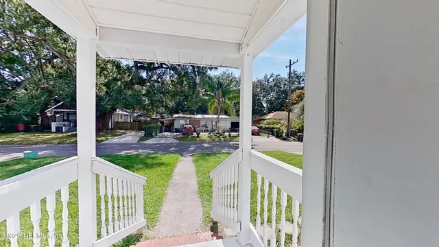 a view of a patio from a balcony