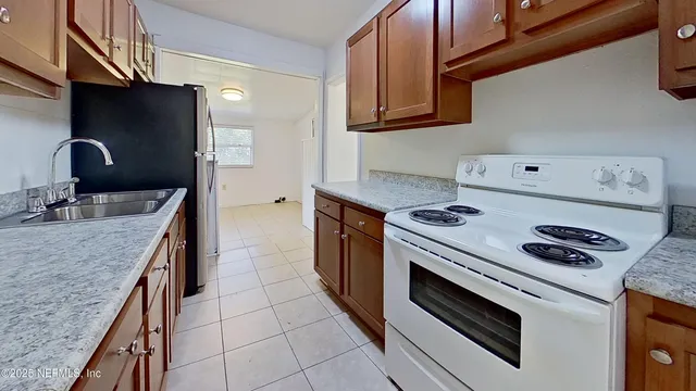 a kitchen with a stove and a sink