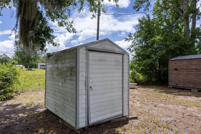 a view of a yard with trees