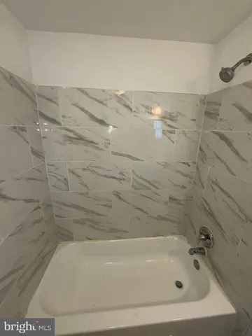 a bathroom with bathtub