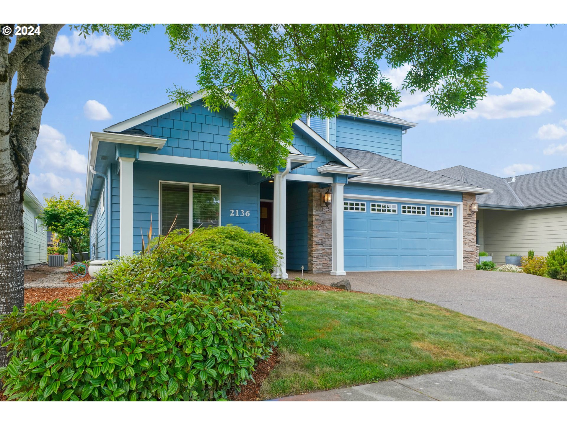 2136 Southeast Rhododendron Avenue Dallas, OR 97338 - Photo 3 of 36 a view of a house with a yard and potted plants
