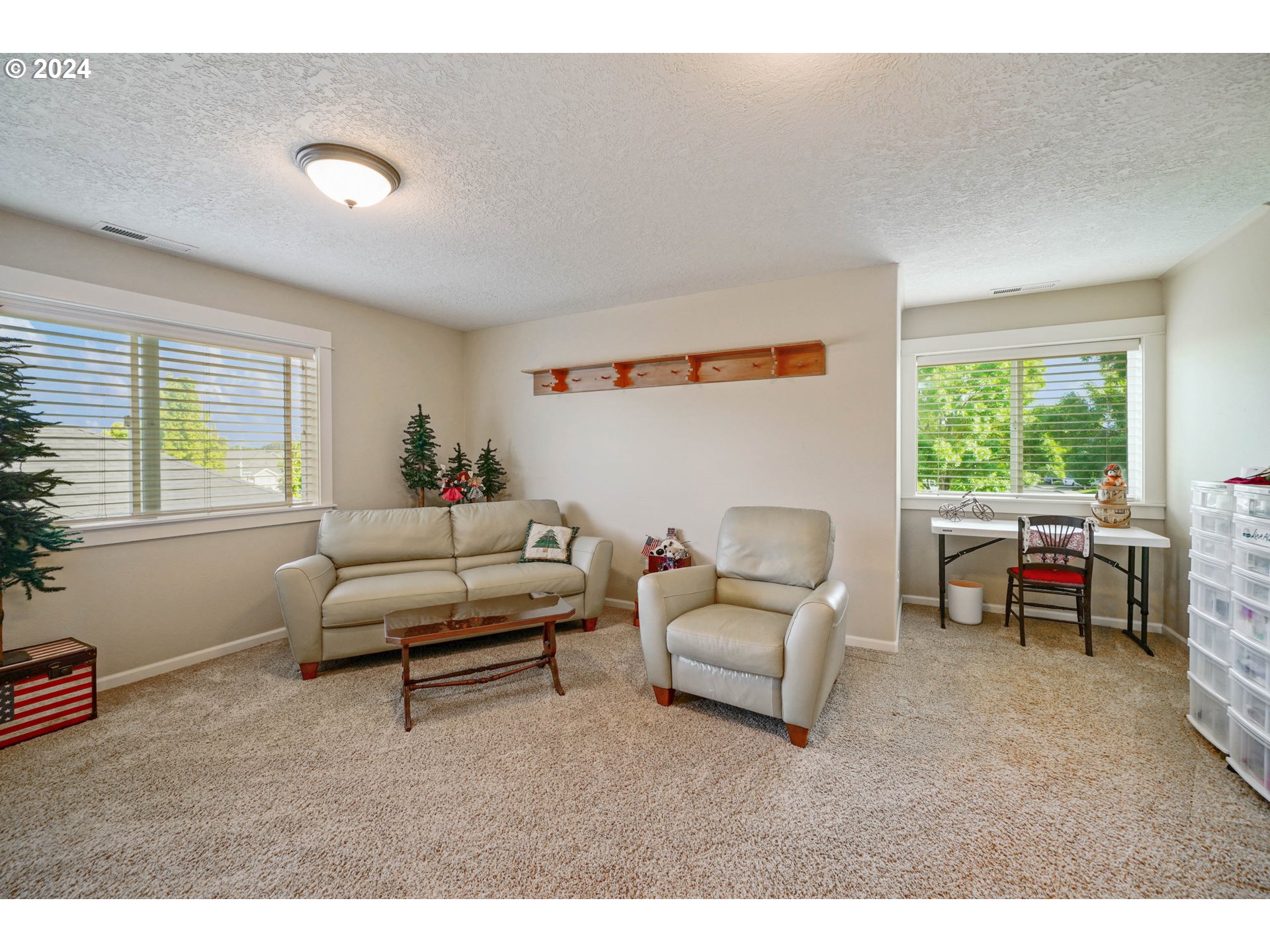 2136 Southeast Rhododendron Avenue Dallas, OR 97338 - Photo 32 of 36 a living room with furniture and a window