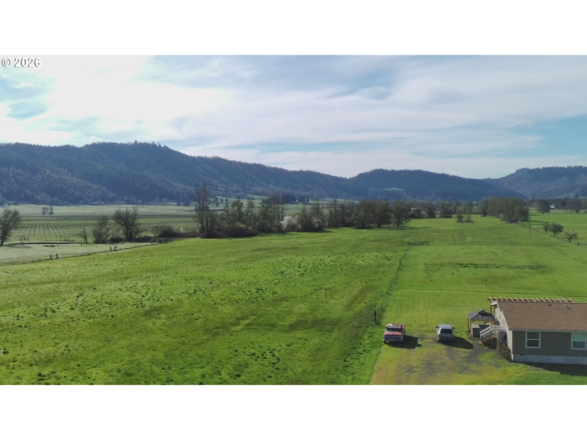 6404 Lookingglass Road Roseburg, OR 97471 - Photo 7 of 48 a open area with mountains in the background