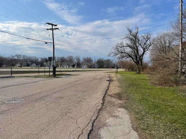 a view of a road with a yard