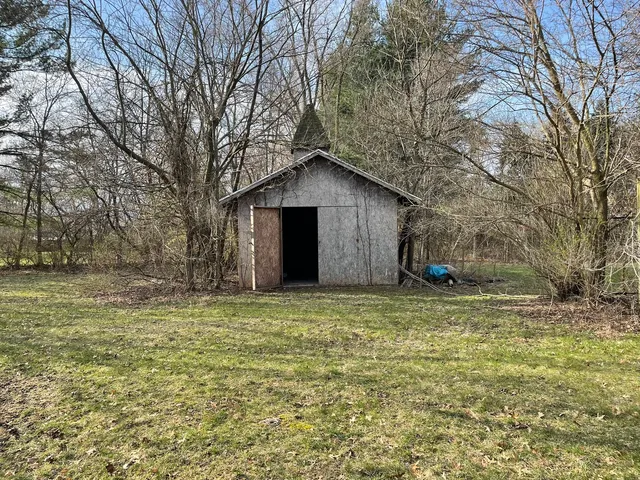 a big house with a big yard and large tree