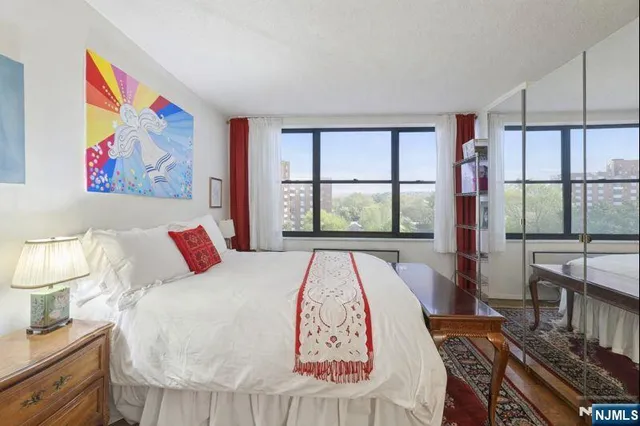 a bedroom with bed and window