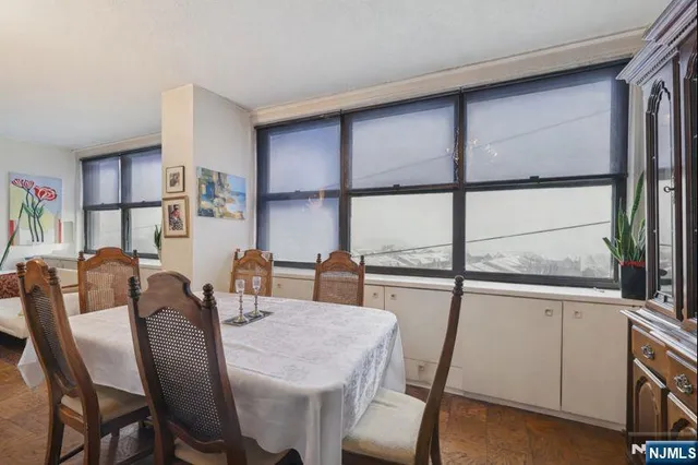 a large white kitchen with a large window