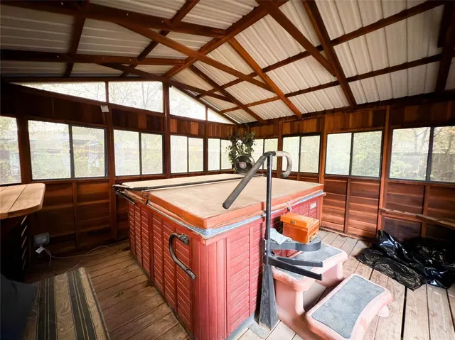 a view of a room with gym equipment and a large window