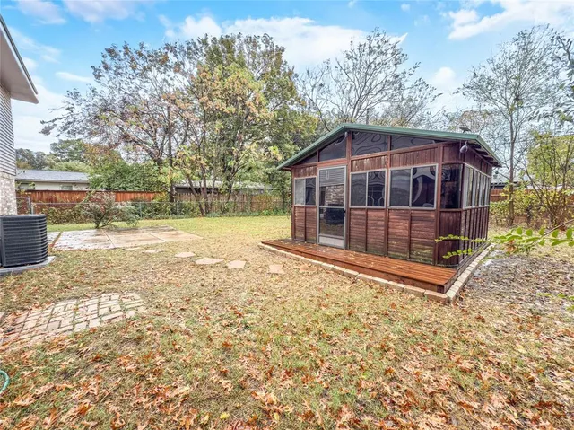 a view of a house with a yard covered with snow in the yard