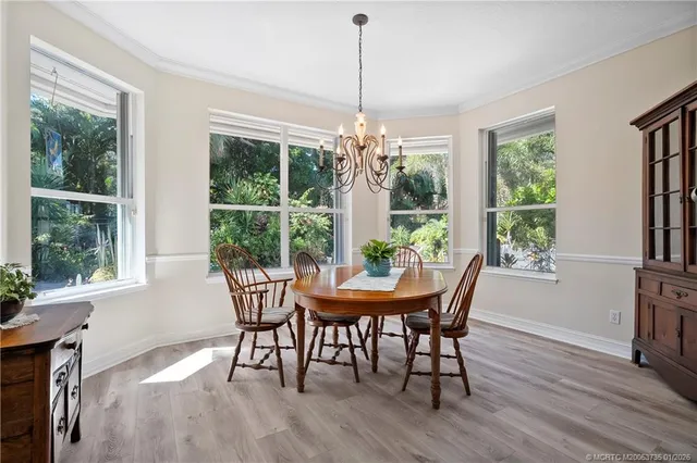 a dining room with furniture window wooden floor