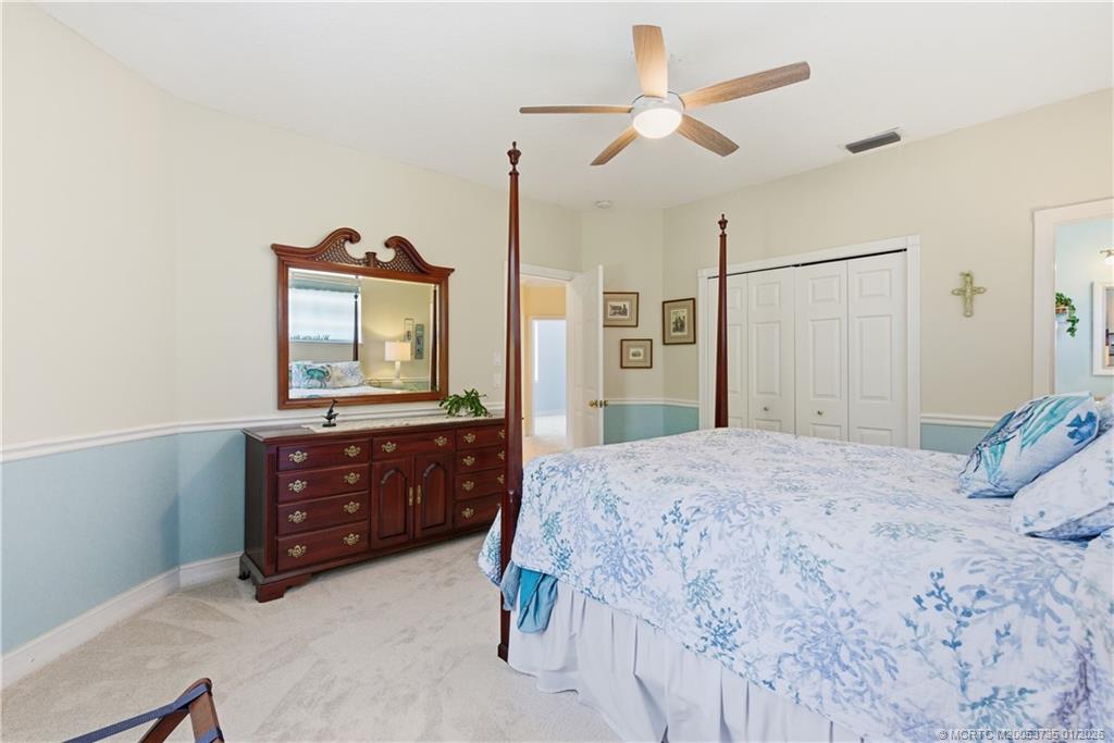 4 Lantana Lane Sewall's Point, FL 34996 - Photo 24 of 47 a bedroom with a bed window and a dresser
