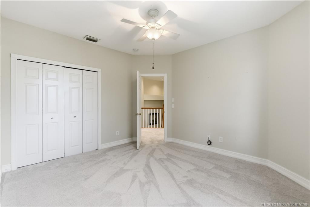 4 Lantana Lane Sewall's Point, FL 34996 - Photo 29 of 47 a view of a chandelier fan and entryway