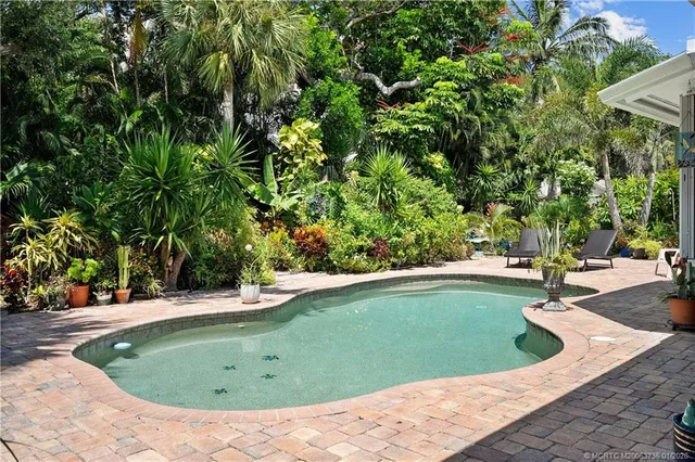 a view of a swimming pool with a sitting area